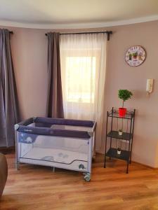 Łóżko lub łóżka w pokoju w obiekcie Pannonia Apartman