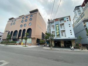 a building on the side of a city street at Nice Hue Hotel in Hue