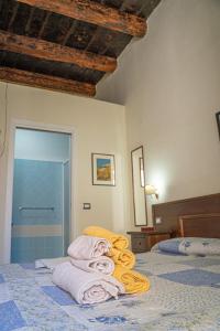 Postel nebo postele na pokoji v ubytování Palazzo Tranfo Al Duomo Accommodation