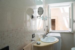 Koupelna v ubytování Palazzo Tranfo Al Duomo Accommodation + 96 fotografií