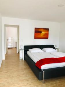 Un pat sau paturi într-o cameră la Haus Pannonsee