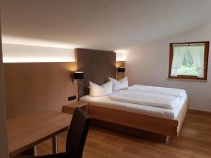 Postel nebo postele na pokoji v ubytování Landhaus Almrausch