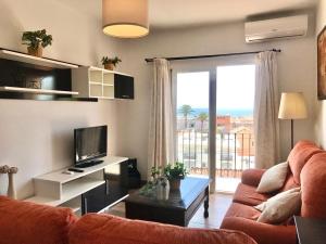 Televízia a/alebo spoločenská miestnosť v ubytovaní Pedregalejo I & private terrace by ELE Apartments