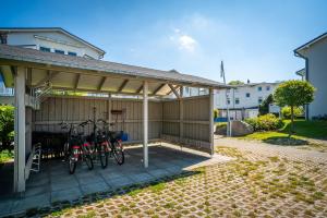a garage with two bikes parked in it at Haus Heidelberg in Göhren