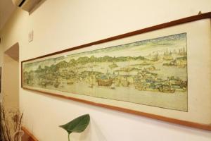 a picture of a painting hanging on a wall at Hotel Zara Napoli in Naples