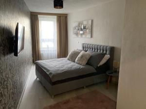 Posteľ alebo postele v izbe v ubytovaní Apartmán Champion