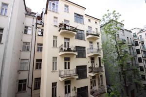 an apartment building with balconies on the side of it at Prague Central Exclusive Apartments in Prague