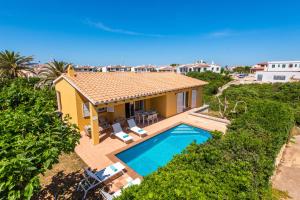 an aerial view of a house with a swimming pool at Villa Laura in Cala en Forcat