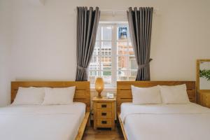 Postel nebo postele na pokoji v ubytování T&K Guesthouse