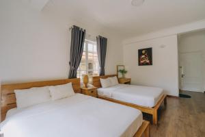 Postel nebo postele na pokoji v ubytování T&K Guesthouse