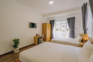 Postel nebo postele na pokoji v ubytování T&K Guesthouse