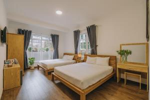 Postel nebo postele na pokoji v ubytování T&K Guesthouse