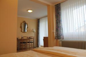 Postel nebo postele na pokoji v ubytování Hotel Brigitte