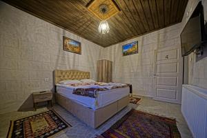 Tempat tidur dalam kamar di Epoch Stone House