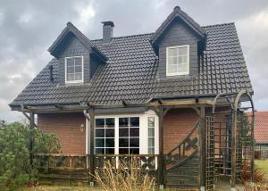 a house with a gambrel roof at Ferienhaus 6 an der Ostsee in Schönhagen in Brodersby OT Schönhagen