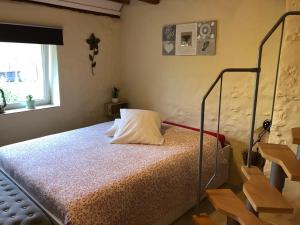 A bed or beds in a room at Le Potiron