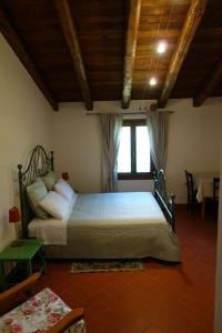a bedroom with a large bed in a room at Monte Bibele in Monterenzio
