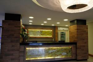 a lobby with a large aquarium in a room at Sky Ville Hotel Gramado in Gramado
