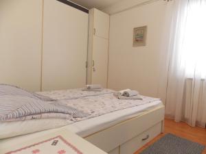 Posteľ alebo postele v izbe v ubytovaní Apartment Sladić