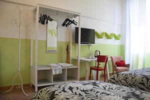 Ένα ή περισσότερα κρεβάτια σε δωμάτιο στο Ottavo Portone