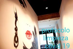 a room with a wall with a sign on it at LOFT MON in Zaragoza