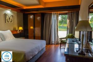 Giường trong phòng chung tại Hotel Lara