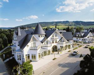 an aerial view of a large white house at Park Resort in Willingen