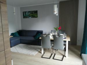 Posedenie v ubytovaní Apartament Zielone Wzgórze