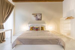 A bed or beds in a room at APPARTAMENTO AL CASTELLO