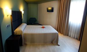 Postel nebo postele na pokoji v ubytování Hotel Torre de Núñez