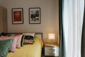 A bed or beds in a room at Harmo no. 1 - Sunny Apartment with big terrace
