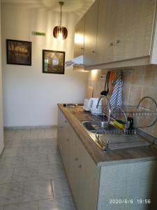 a kitchen with a sink and a counter top at Akamatis Giorgos in Therma