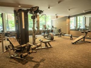 a gym with several exercise equipment in a room at Nadmorskie Tarasy a 407 in Kołobrzeg