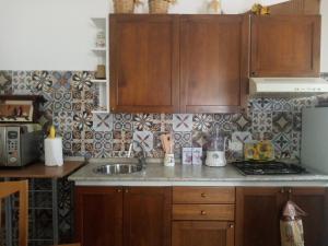 A kitchen or kitchenette at Sweet Home by Giò