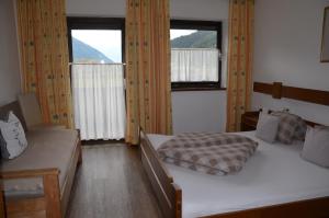 Postel nebo postele na pokoji v ubytování Gästehaus Wildauer