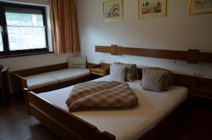 Letto o letti in una camera di Gästehaus Wildauer