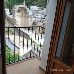 a balcony with a view of a city at Casa Tio Paco in Cazorla