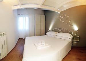 Ένα ή περισσότερα κρεβάτια σε δωμάτιο στο La Casetta di Vale