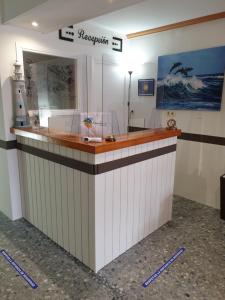 a large counter in a room with a lighthouse at Pension los Verdiales in La Herradura