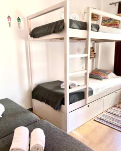 
a bedroom with a bed and a desk at Peneco Albufeira GuestHouse in Albufeira
