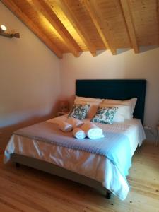 Postel nebo postele na pokoji v ubytování adubai Obidos