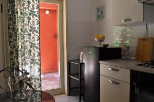 A kitchen or kitchenette at Villa Vittorio - Splendid panoramic sea view terrace
