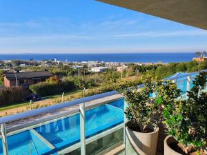 a balcony with a view of the ocean at Edificio "Bahia" Punta Ballena. in Punta del Este