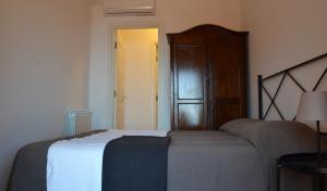 A bed or beds in a room at Villa Vittorio - Splendid panoramic sea view terrace