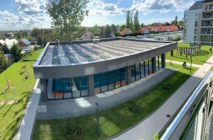 an image of a building with solar panels on the roof at Apartament Livia in Sianozety