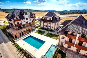 an aerial view of a large house with a swimming pool at Zlatibor Hills Royal in Zlatibor