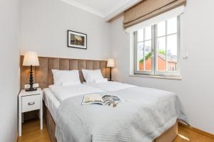 Postel nebo postele na pokoji v ubytování Happy Stay Sopot Monte Cassino 40