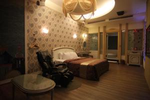 Postel nebo postele na pokoji v ubytování Romantic Code Art Motel