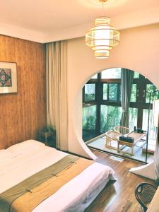 En eller flere senge i et værelse på Dan’s Sea Guest House Hangzhou