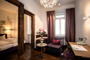 En eller flere senger på et rom på Hotel Münchner Hof und Blauer Turm